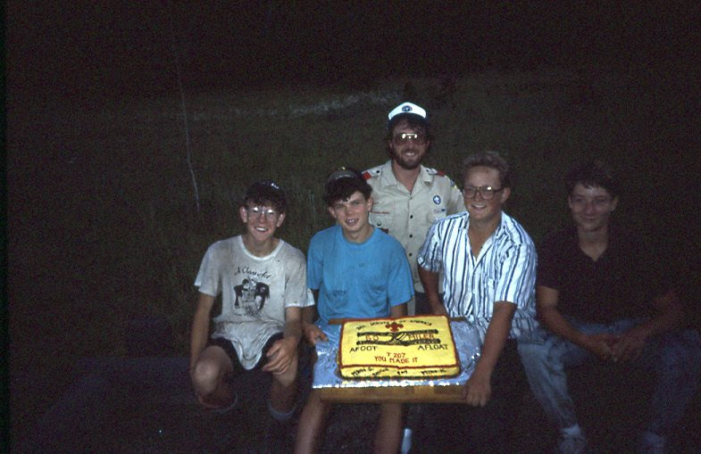 boy scouts holding a cake